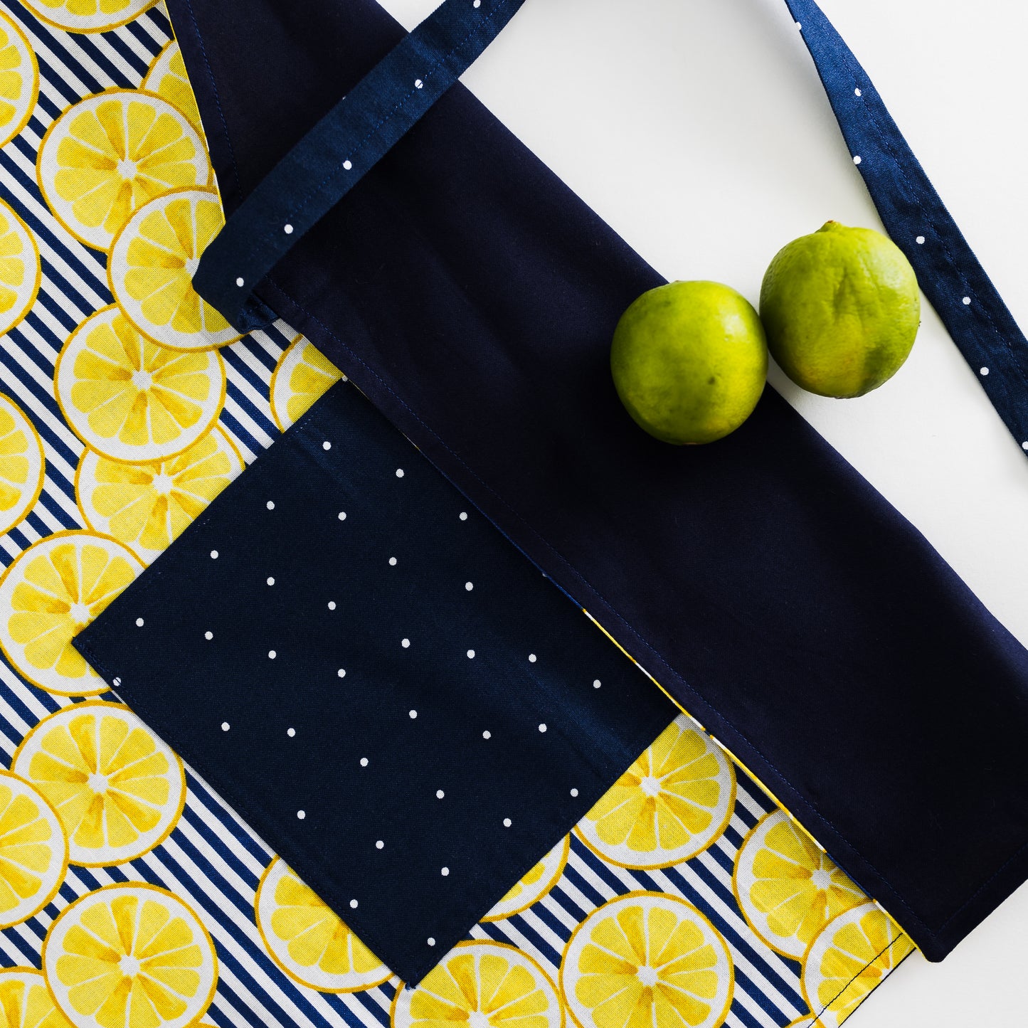 Yellow lemons on blue kids apron