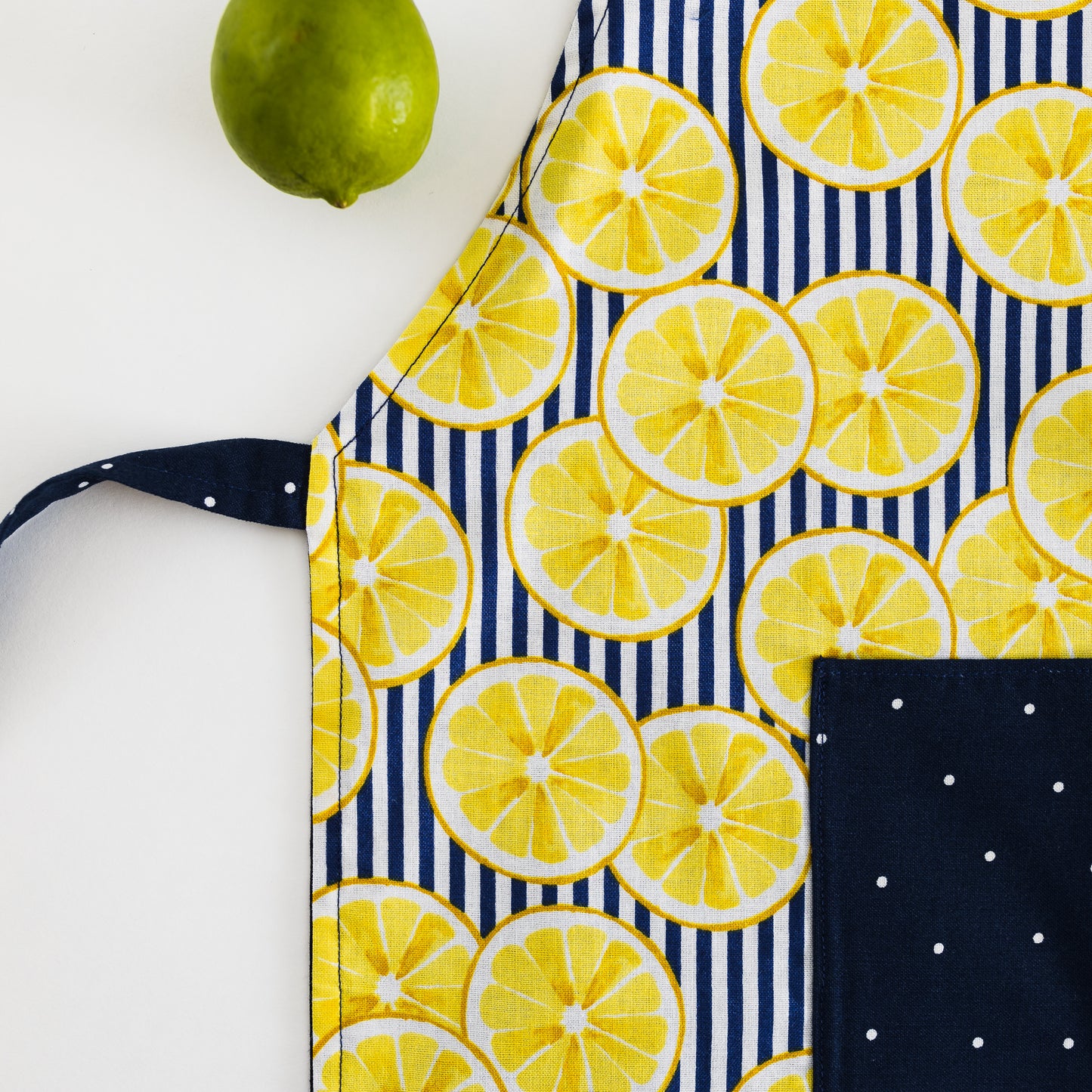 Yellow lemons on blue kids apron