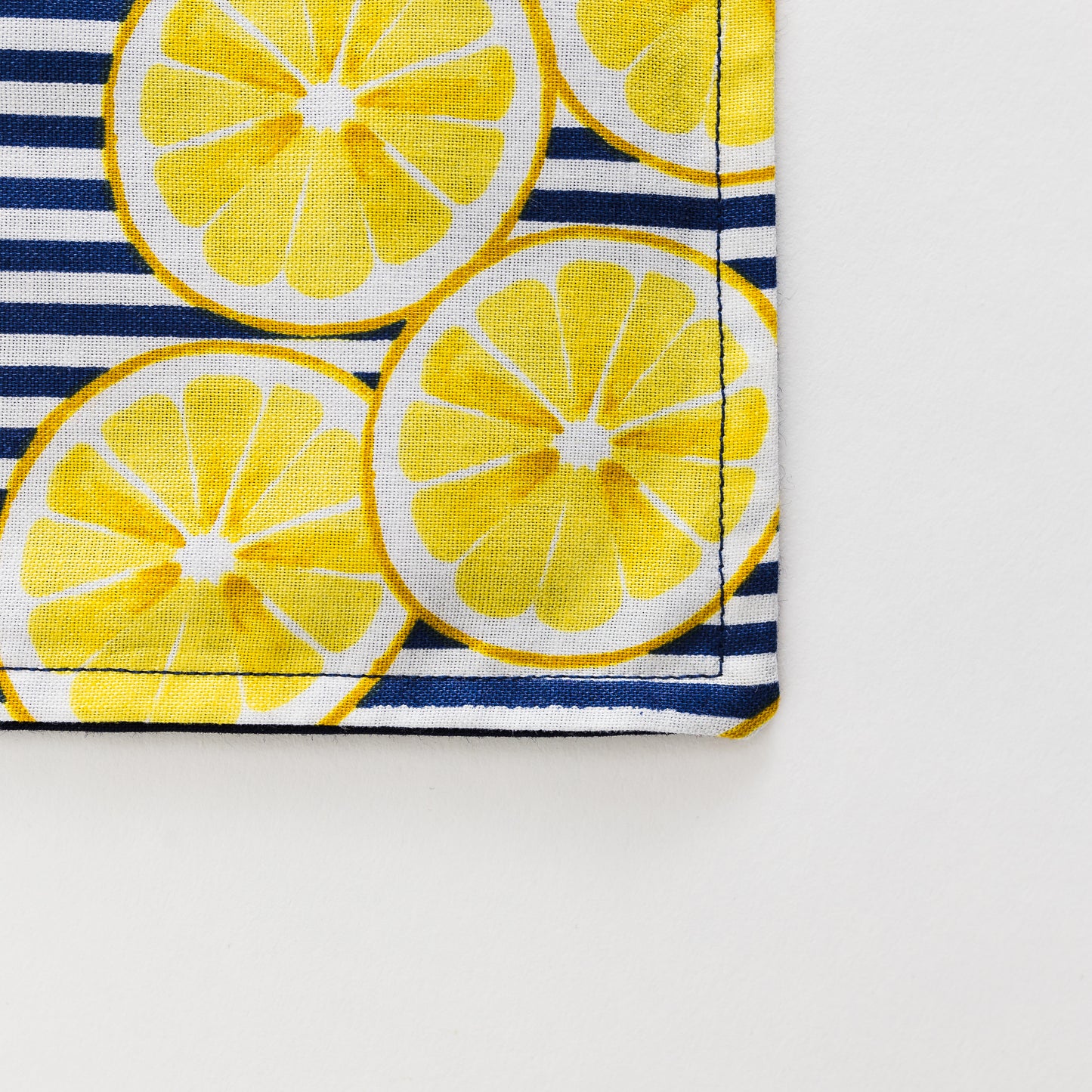 Yellow lemons on blue kids apron