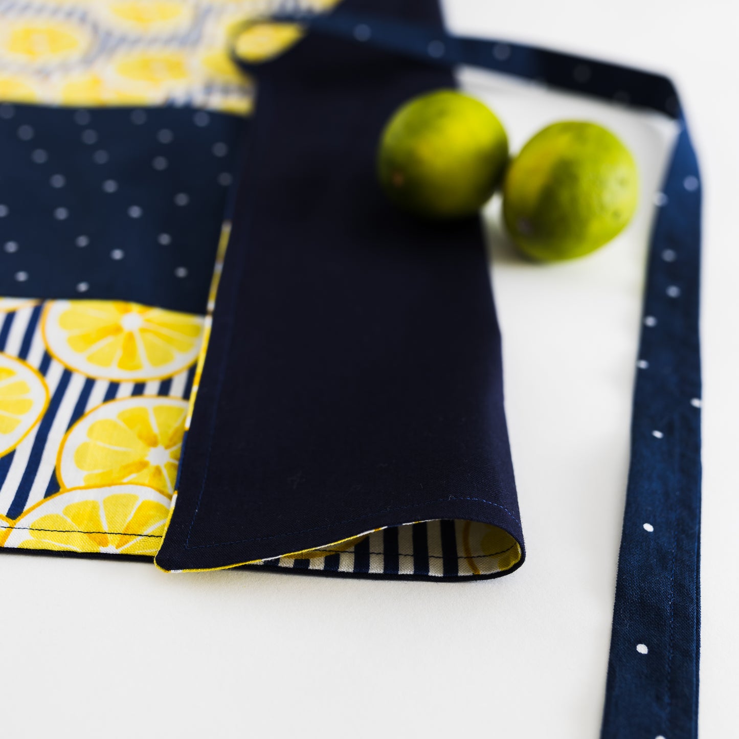 Yellow lemons on blue kids apron