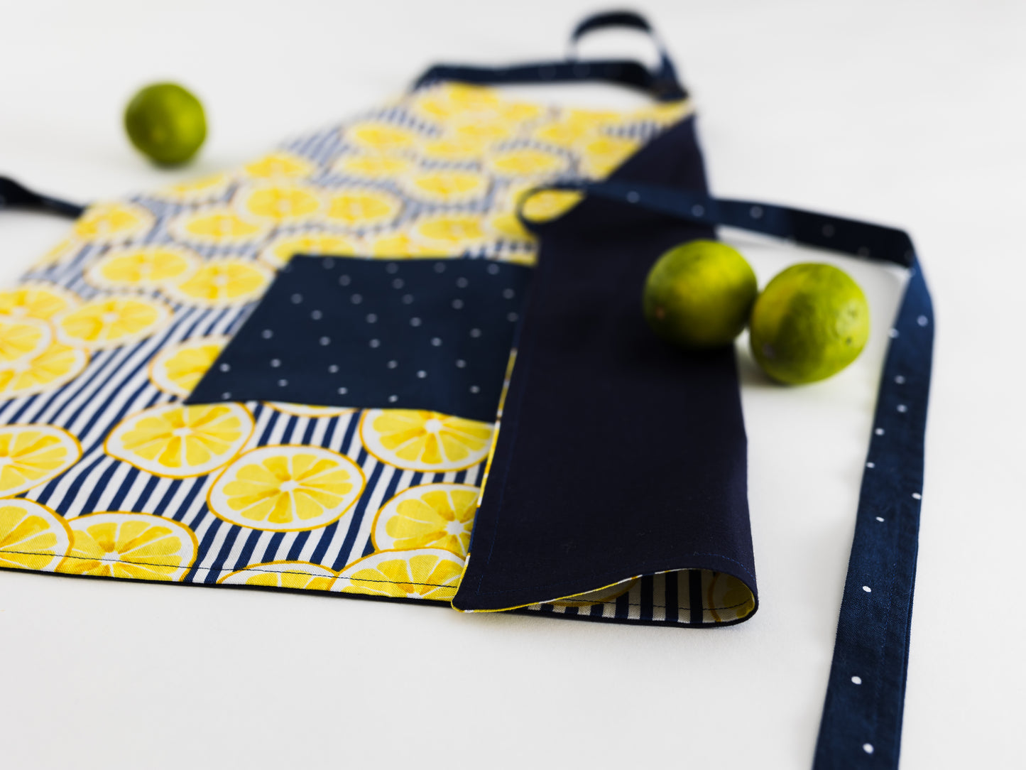 Yellow lemons on blue kids apron